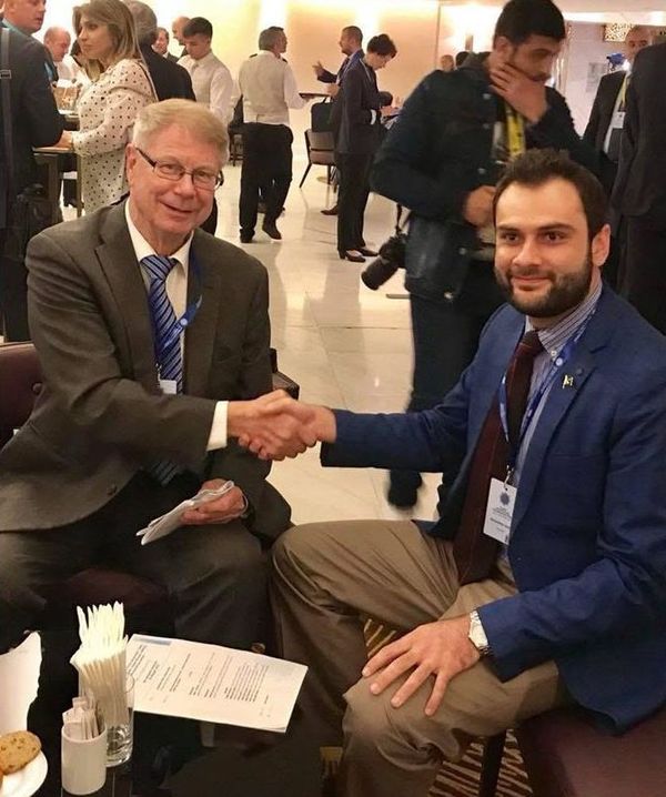 Sahibzada Muhammad Saeed meeting and shaking hands with an international delegate