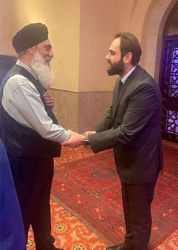Sahibzada Muhammad Saeed exchanging greetings with a distinguished Sikh scholar